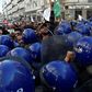 Algerian riot police block the progress of an anti-government demonstration heading towards the presidential palace in the capital Algiers, on Saturday
