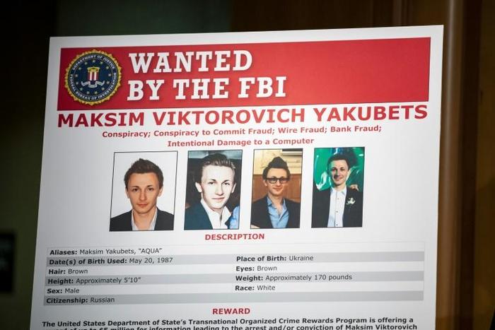 The FBI wanted poster of Maksim Viktorovich Yakubets, a Russian hacker known as 'aqua' indicted Thursday for a decade-long cybertheft spree