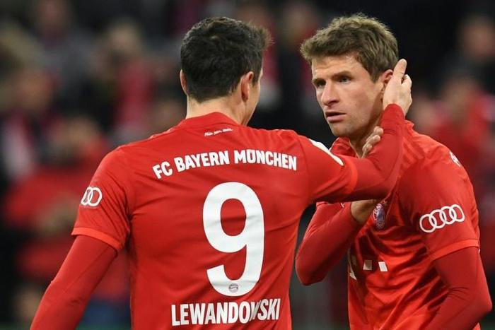 Bayern Munich's German forward Thomas Mueller (R) enjoys a key partnership with Poland striker Robert Lewandowski