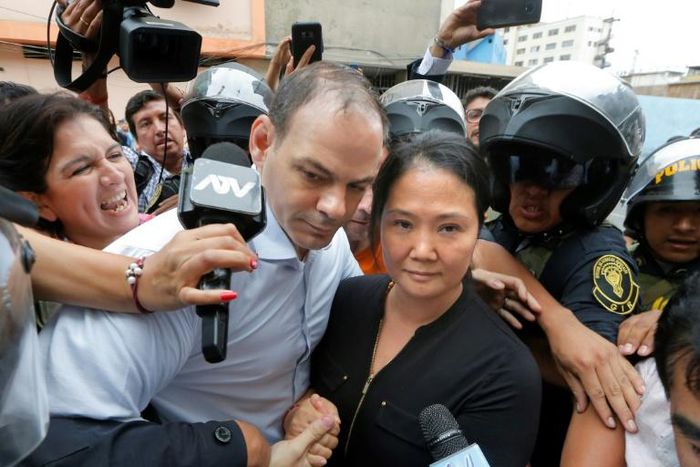 Keiko Fujimori arrives at a Lima courthouse with her husband Mark Villanella on Tuesday