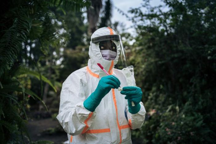 A health worker prepares equipment for a COVID-19 test in Goma in  northeastern DRC