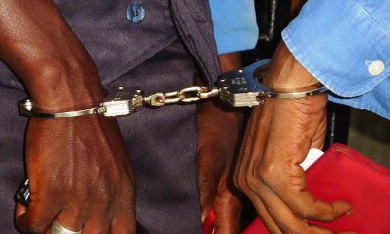 Suspects handcuffed together