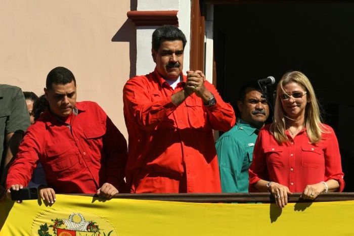 Venezuela President Nicolas Maduro (center) goads opposition leader Juan Guaido at an 'anti-imperialsim' rally in the capital Caracas