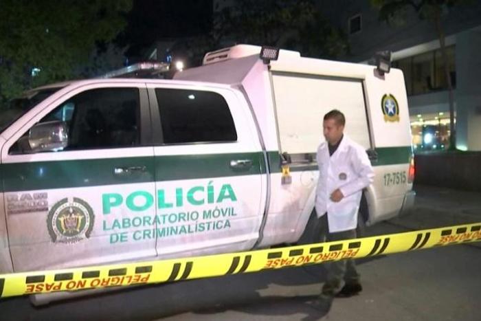 A police forensics van at the scene where a French defense systems engineer was shot dead in Bogota, Colombia
