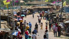 Rohingya refugees gather in a market area of the Kutupalong refugee camp in Bangladesh on March 24, 2020 -- "social distancing" to protect against the coronavirus pandemic is "virtually impossible", an NGO said