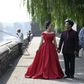 A couple pose for pre-wedding pictures at the north gate of the Palace Museum in Beijing