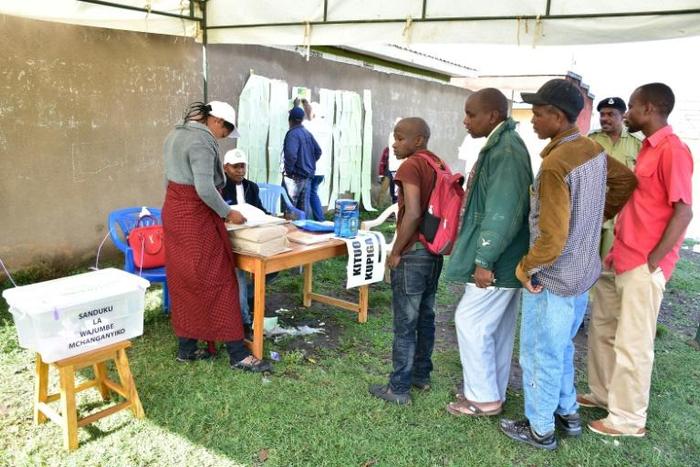 Residents queue to vote at a polling station during the local elections in the town of Arusha, north Tanzania, on November 24, 2019