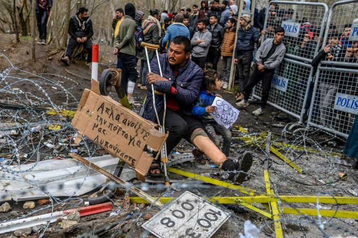 Greek officials accused Turkey of firing tear gas and smoke bombs at their border guards and providing cutters to migrants to break through fencing