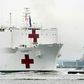 The USNS Comfort medical ship moves up the Hudson River past the Statue of Liberty as it arrives on March 30, 2020 in New York