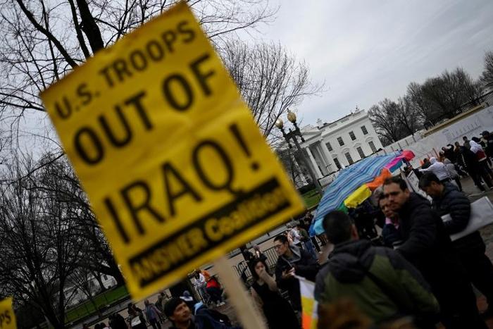 Demonstrators rally outside the White House to denounce the killing of a senior Iranian general in Iraq