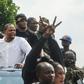 Liberian radio show host and opposition leader Henry Costa (2nd L) is one of those behind the anti-government protests