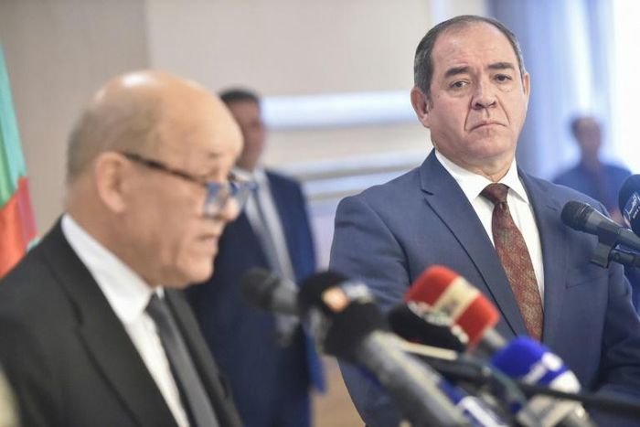 Algerian Foreign Minister Sabri Boukadoum (R) listens to his French counterpart Jean-Yves Le Drian during a joint press conference in the capital Algiers