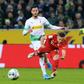 Borussia Moenchengladbach's Algeria defender Ramy Bensebaini (L) equalised with a header, then scored a late penalty to seal their 2-1 win at home to defending champions Bayern Munich on Saturday.