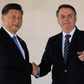 China's President Xi Jinping (L) and Brazil's President Jair Bolsonaro (L) before a summit in Brasilia of the BRICS countries where global trade was on the agenda