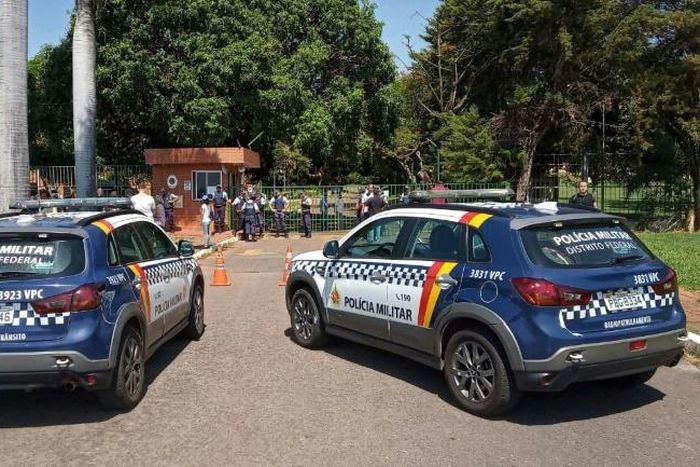 Military police patrol the surroundings of the Venezuelan embassy in Brasilia, Brazil, on November 13, 2019, while loyalists to President Nicolas Maduro and to Venezuelan opposition leader Juan Guaido face off inside the country's embassy
