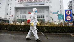 Images of health workers have dominated the airwaves as the government tries to shield itself from public rage over the handling of the deadly outbreak