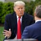 US President Donald Trump (L) speaks with anchor Bill Hemmer during a Fox News virtual town hall meeting from the Rose Garden of the White House in Washington, DC, on March 24, 2020
