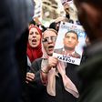 People march with signs calling for the release of detained Algerian opposition figure Karim Tabbou on January 24, 2020, during the 49th consecutive Friday demonstration against the Algerian government and the ruling class in Algiers
