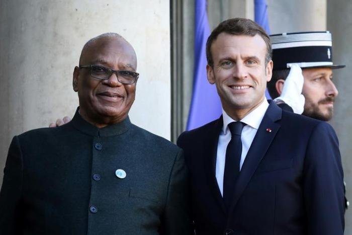 Mali's leader Ibrahim Boubacar Keita, seen here with French President Emmanuel Macron, has urged Malians against hostility to foreign forces in the country