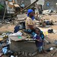 Residents of Adjouffou prepare to leave their homes -- part of the area is being razed to make way for a buffer zone around the airport