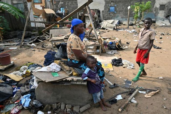 Residents of Adjouffou prepare to leave their homes -- part of the area is being razed to make way for a buffer zone around the airport