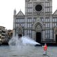 A municipal worker disinfects the Piazza Santa Croce in Florence as part of the measures taken by the Italian government to fight the spread of the COVID-19