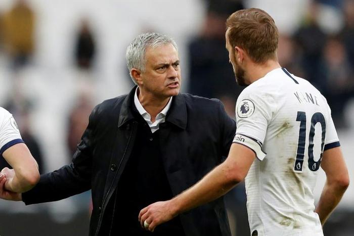 Tottenham manager Jose Mourinho talks to forward Harry Kane after their 3-2 win at West Ham