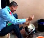 Francis Xavier-Sosu shows his banku stirring skills during door-to-door campaign