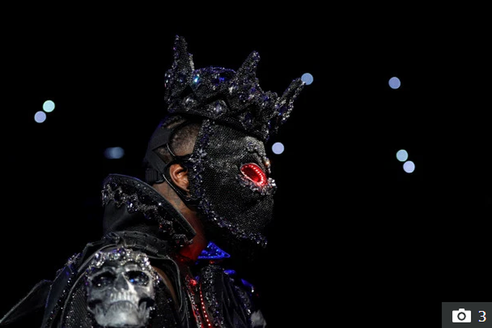 Deontay Wilder wore a mask complete with glowing red eyes for his ring walk- Credit: Reuters