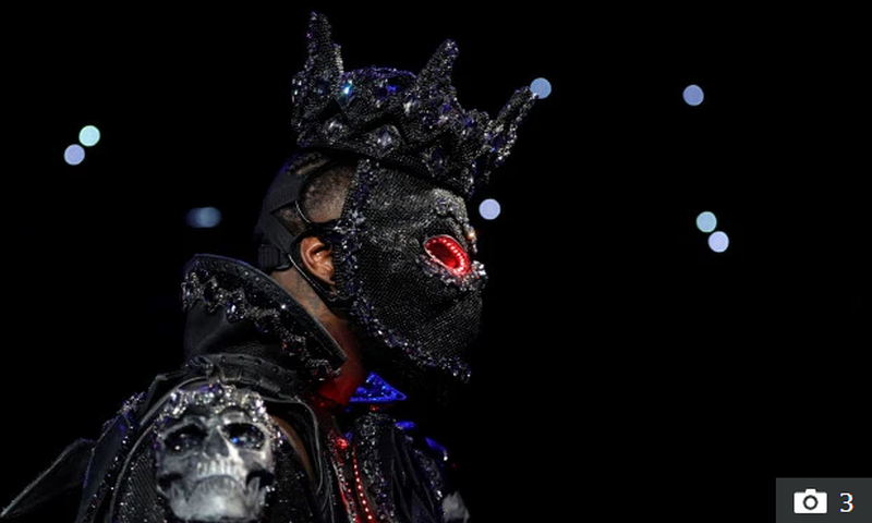 Deontay Wilder wore a mask complete with glowing red eyes for his ring walk- Credit: Reuters