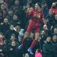 Towering clear: Virgil van Dijk's opening goal helped send Liverpool 16 points clear at the top of the Premier League