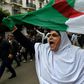An Algerian woman waves a national flag during an  anti-government demonstration in the capital Algiers on March 14, 2020