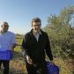 Turkish-Cypriot Hasan Siber (L) and Greek-Cypriot Alexandros Philippides walk in an olive grove in Mora (Meriç), a village in the self-proclaimed Turkish Republic of North Cyprus near the divided capital Nicosia
