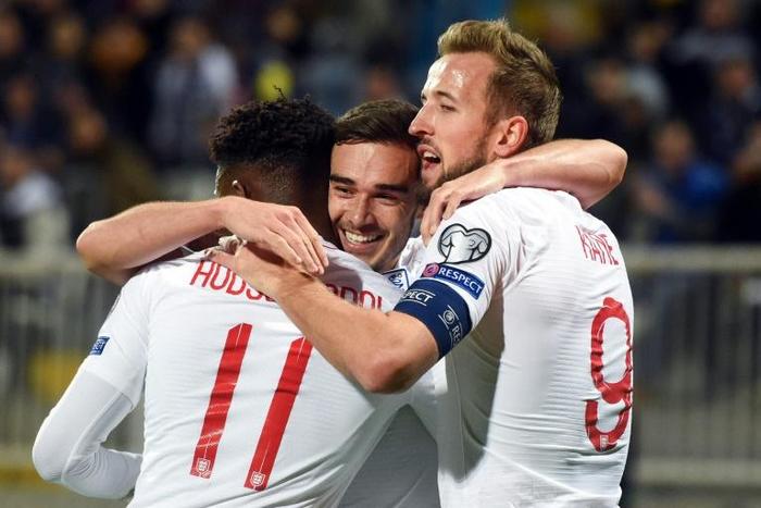 England's Harry Winks (C) celebrates after scoring the opening goal against Kosovo