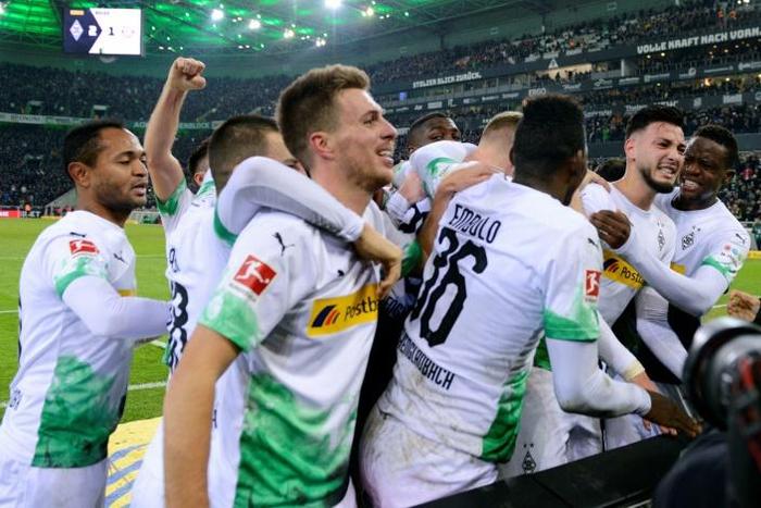 Remind me: Moenchengladbach's Algerian defender Ramy Bensebaini celebrates after converting the late penalty winner