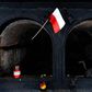 A Polish flag waves in front of a crematorium oven at the former site of the Gusen death camp in Austria, which Warsaw is pushing to be memorialised