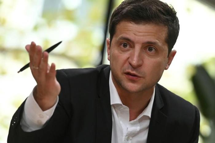 Ukrainian President Volodymyr Zelensky speaks to media on October 10, 2019