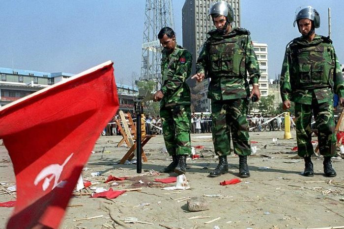 Bangladeshi soldiers inspect the scene of the 2001 bomb blast in Dhaka