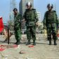 Bangladeshi soldiers inspect the scene of the 2001 bomb blast in Dhaka
