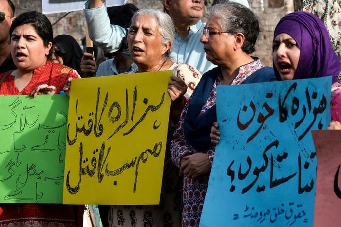 Pakistan human rights activists hold placards during a protest against a suicide blast targeting the Hazara ethnic minority in Lahore in  April 2019