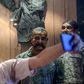 A Pakistan student in Karachi takes a selfie in front of the statue of Indian pilot Wing Commander Abhinandan Varthaman who was shot down over Kashmir earlier this year
