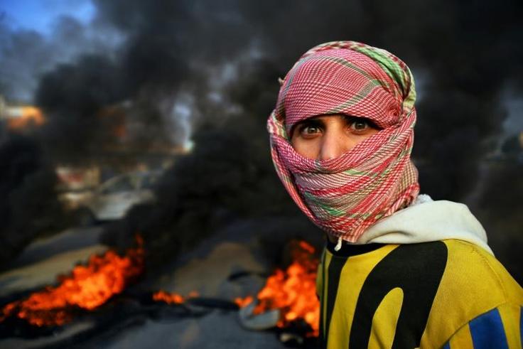 Demonstrators cut roads with flaming tyres in the protest hot spot of the holy Shiite city of Najaf