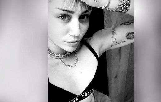 Miley Cyrus Shows Off Toned Abs While Doing Yoga