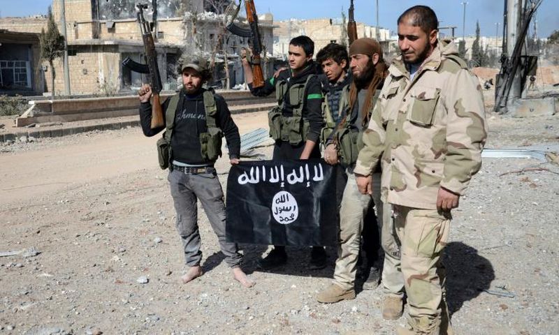 Turkish-backed Syrian fighters take down a black Islamic State group flag during their capture of the northern town of Al-Bab in February 2017