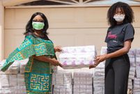 The Minister for Gender, Children and Social Protection, Mrs Cynthia Morrison receiving 2000 ‘Sincerely’ sanitary pads from Ruth Quarshie, a representative of Sincerely Ghana Limited
