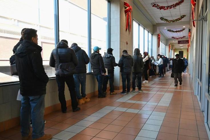 Undocumented immigrants line up to get a driver's license at the Brooklyn Department of Vehicles, New York