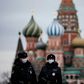 Russian police officers patrol a deserted Red square in front of Saint Basil's Cathedral in Moscow as the capital and other parts of Russia go into lockdown to curb the novel coronavirus.