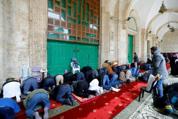 The few hundred faithful who attended Friday prayers in Jerusalem's Al-Aqsa mosque compound did so outside after the Jordanian religious authorities closed the mosque itself in a measure against the coronavirus