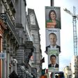 Election posters featuring Sinn Fein President Mary Lou McDonald (top), Irish Prime Minister Leo Varadkar (middle) seen in Dublin ahead of a general election on Sunday