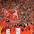 Fans of Guangzhou Evergrande cheer for the team after defeating Shanghai Shenhua to win the Chinese Super League (CSL) football championship in Guangzhou in China's southern Guangdong province in December
